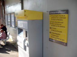 Sign next to one of the ticket machines near the middle of the platform