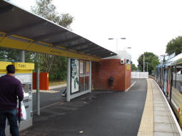 Looking towards Bury on the side of the island platform for trams to Manchester (though coming from the stairs there's no indicator which platform is which -- there are signs facing the lift behind the stairs)