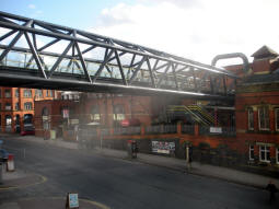 The bridge to Deansgate railway station from the nearby stairs down to Deansgate
